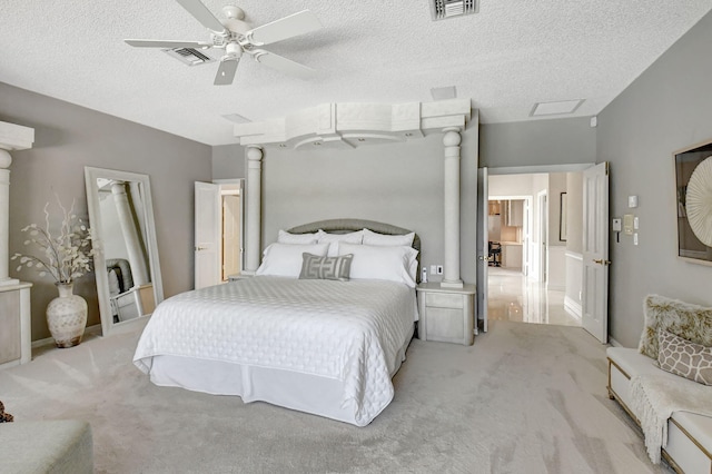 carpeted bedroom with a textured ceiling and ceiling fan