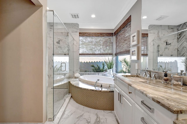 bathroom featuring vanity and separate shower and tub