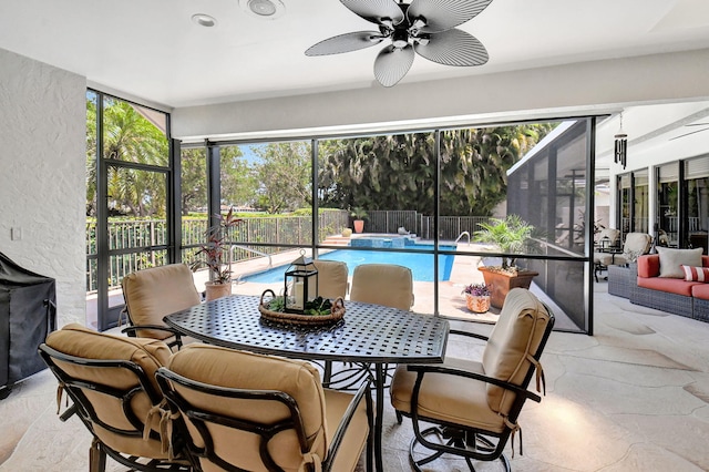 sunroom with ceiling fan