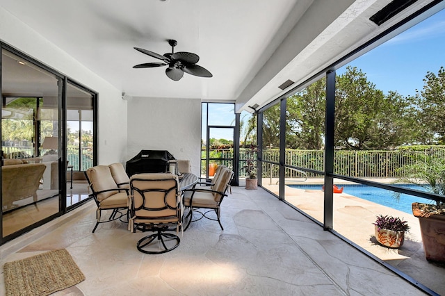 sunroom / solarium with ceiling fan