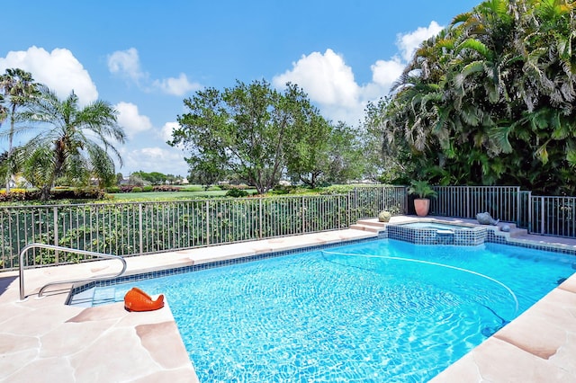 view of pool featuring an in ground hot tub and a patio area