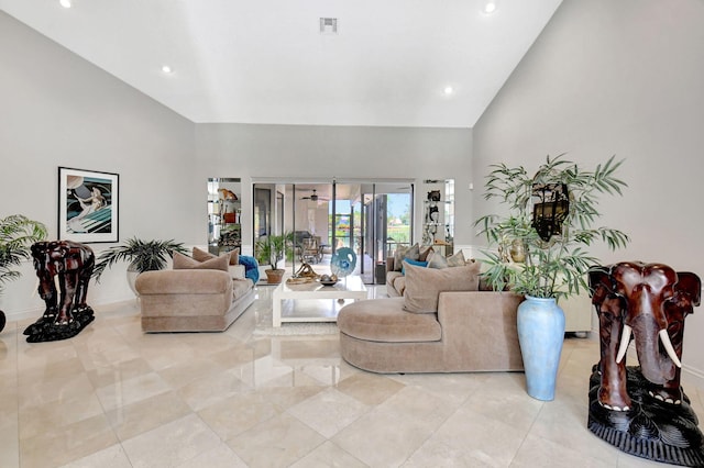 living room featuring high vaulted ceiling and light tile patterned floors