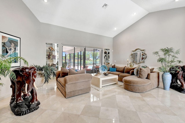 living room with high vaulted ceiling and light tile patterned floors