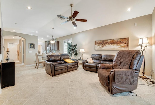 living room featuring vaulted ceiling and ceiling fan