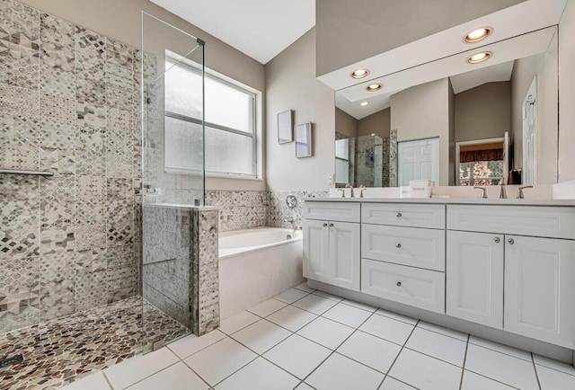 bathroom with vanity, tile patterned floors, and shower with separate bathtub