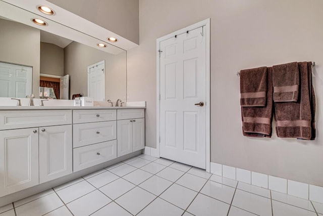 bathroom featuring vanity and tile patterned flooring