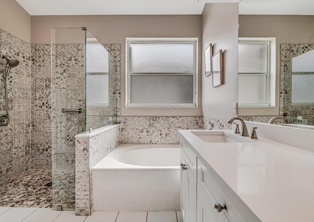 bathroom featuring tile patterned floors, vanity, and independent shower and bath