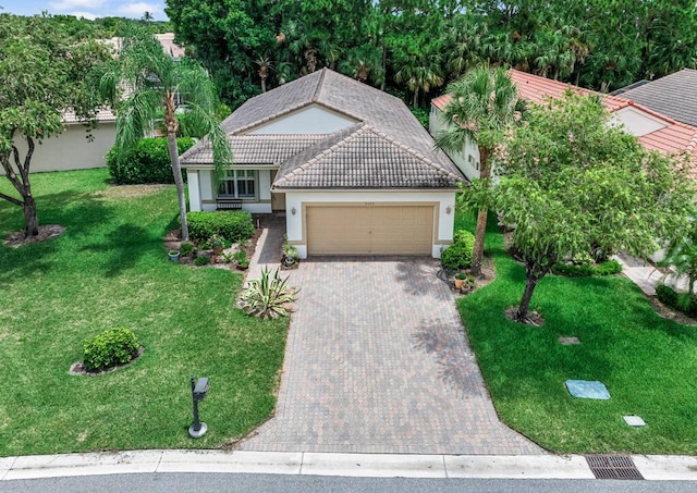 view of front facade featuring a front lawn and a garage