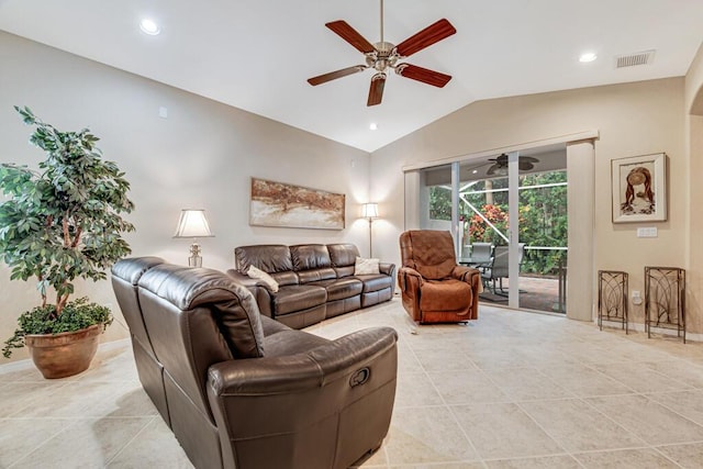 living room with light tile patterned floors and lofted ceiling