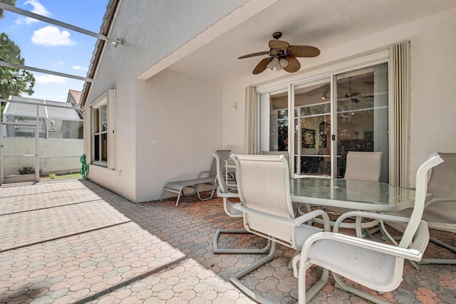 view of patio / terrace featuring ceiling fan