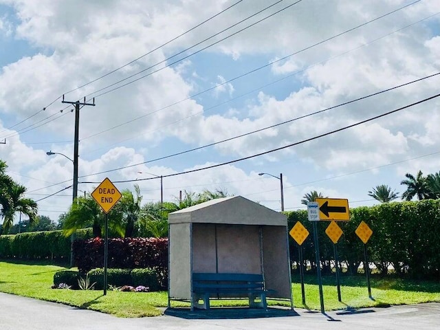 view of property's community with a lawn