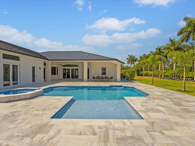 view of pool with ceiling fan, a patio area, an in ground hot tub, and french doors