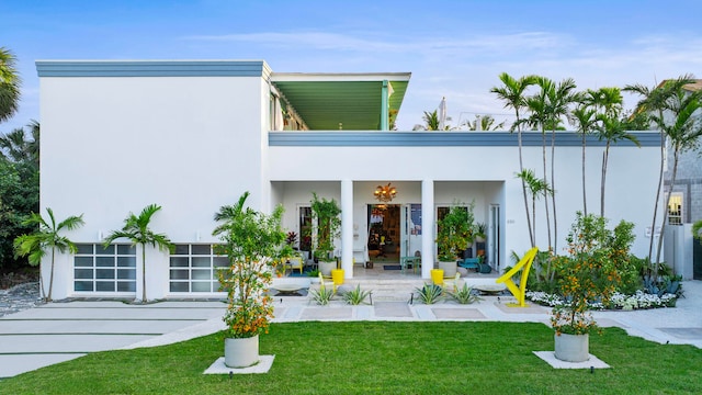 rear view of house with a lawn