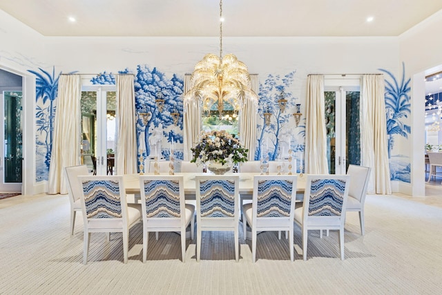 carpeted dining space with a healthy amount of sunlight, crown molding, and a chandelier