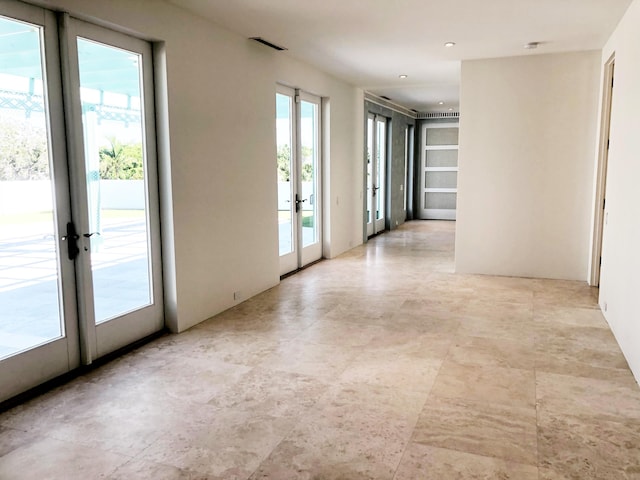 unfurnished room with french doors