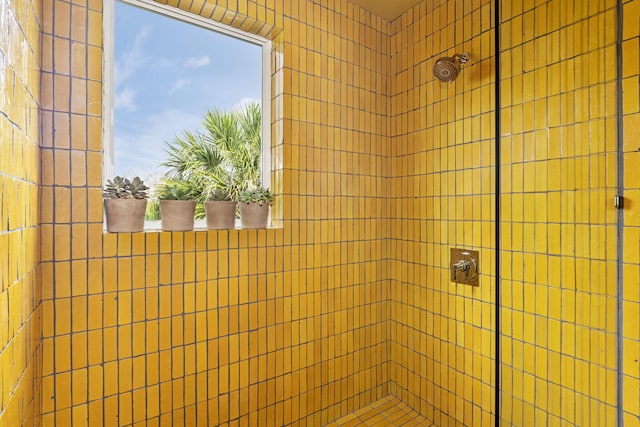 bathroom with a tile shower