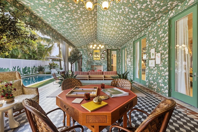 dining space featuring a notable chandelier