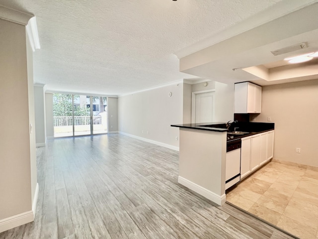 kitchen featuring white cabinetry, dishwasher, sink, crown molding, and light hardwood / wood-style flooring