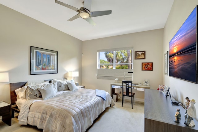 bedroom featuring light colored carpet and ceiling fan