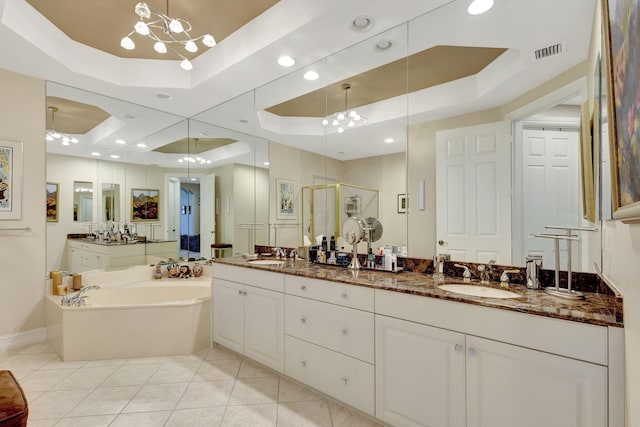 bathroom featuring vanity, an inviting chandelier, a raised ceiling, tile patterned flooring, and shower with separate bathtub