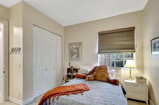 carpeted bedroom with a closet