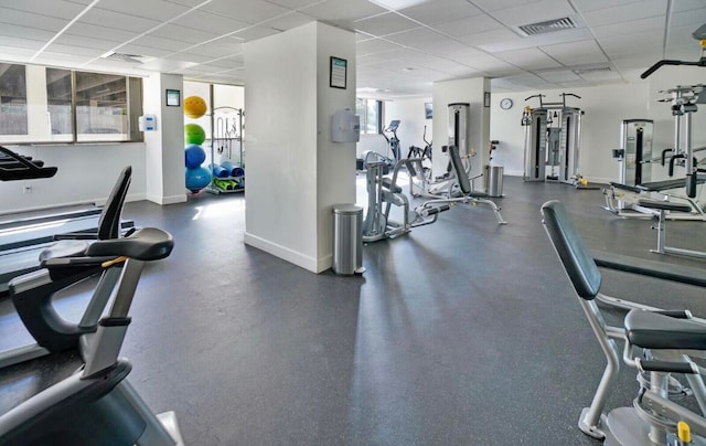 exercise room featuring a paneled ceiling