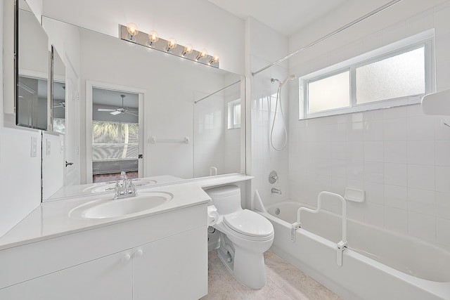 bathroom featuring shower / bathtub combination, vanity, tile patterned flooring, and toilet