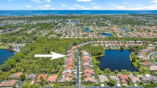 aerial view featuring a water view and a residential view