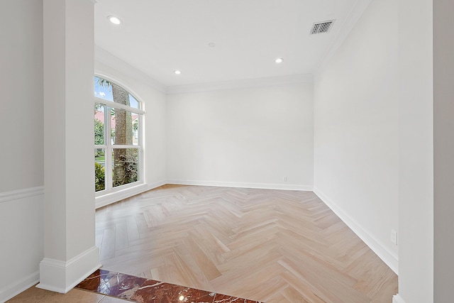 empty room with crown molding, recessed lighting, visible vents, and baseboards