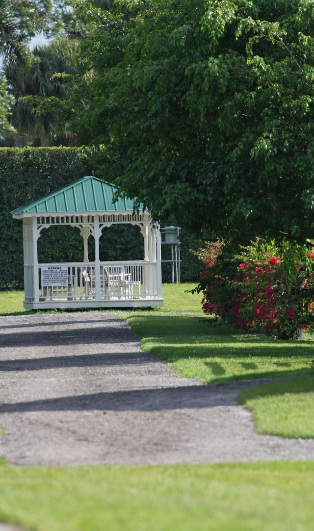 view of home's community with a gazebo and a lawn