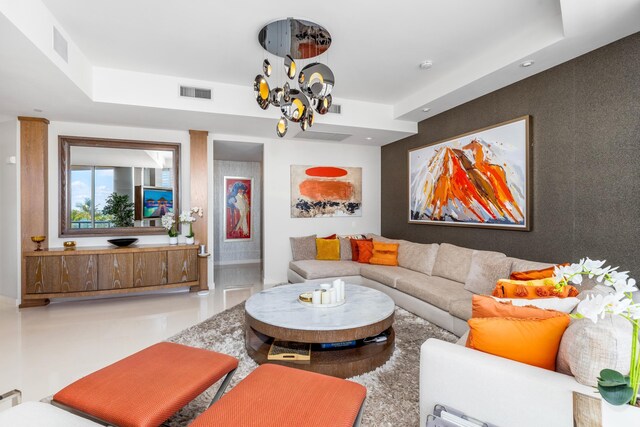 living room featuring a notable chandelier