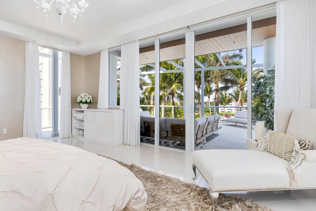 bedroom featuring access to outside and expansive windows