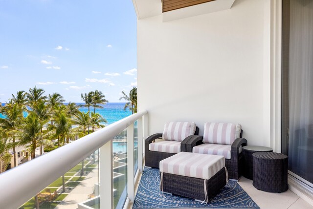 balcony featuring a water view