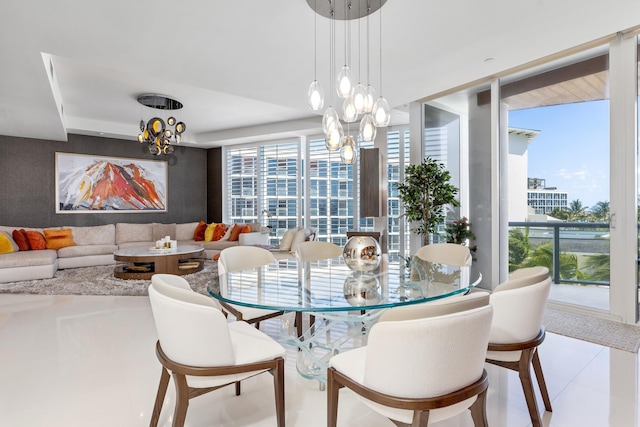 tiled dining area with an inviting chandelier and expansive windows