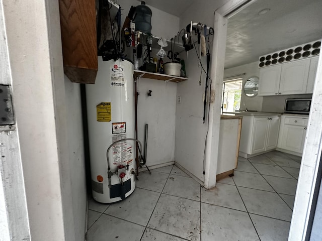 utility room with gas water heater