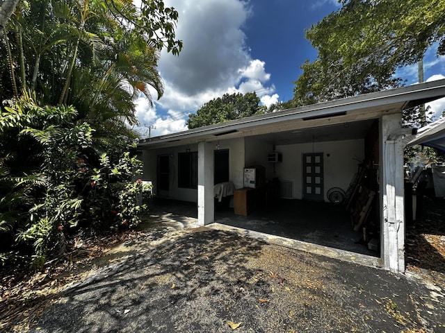 exterior space with a carport