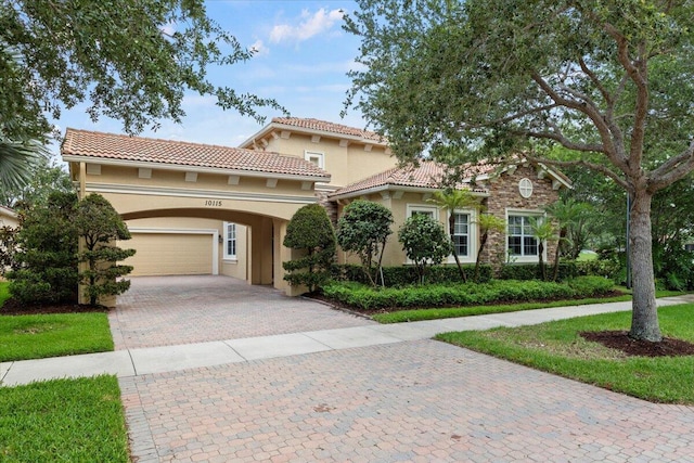 mediterranean / spanish-style home featuring a garage