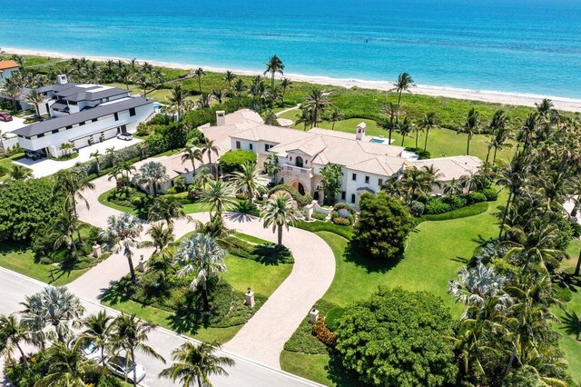 drone / aerial view featuring a view of the beach and a water view