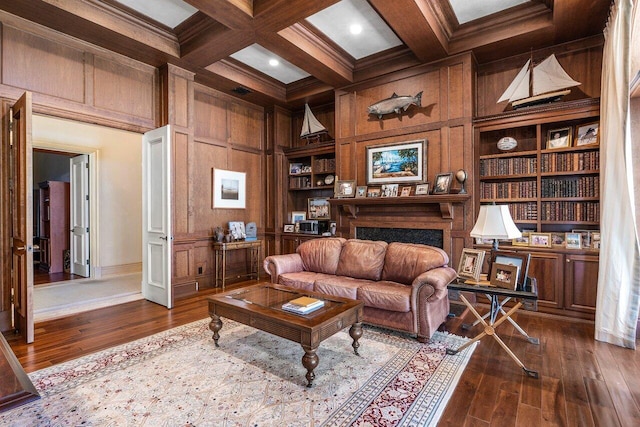 sitting room with wood walls, a fireplace, coffered ceiling, beam ceiling, and dark wood finished floors