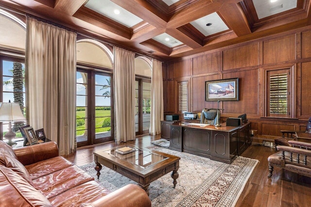 home office with ornamental molding, beamed ceiling, hardwood / wood-style floors, wood walls, and coffered ceiling