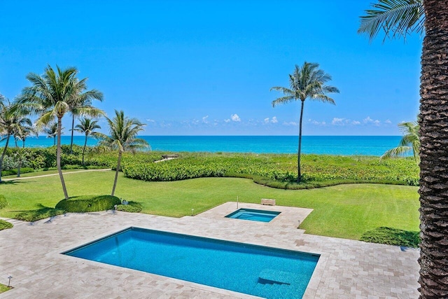 view of pool featuring a patio, an in ground hot tub, and a water view