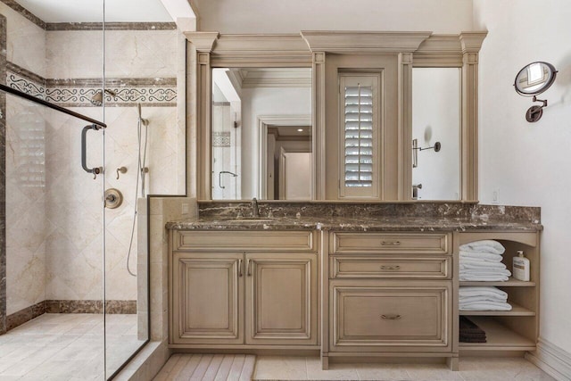 bathroom with an enclosed shower, vanity, tile floors, and crown molding