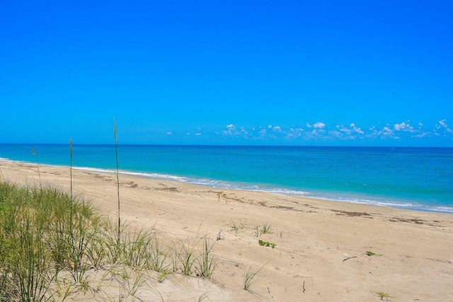 view of water feature with a beach view