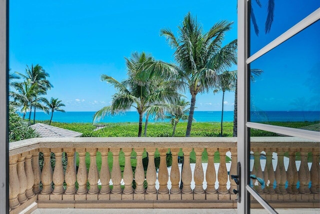 balcony featuring a water view