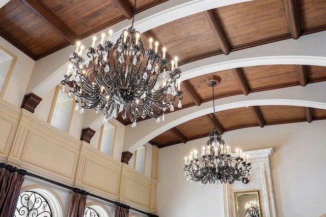 room details featuring a notable chandelier, wooden ceiling, and beam ceiling