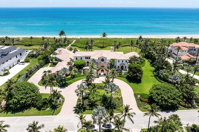 aerial view with a view of the beach, a water view, and a residential view