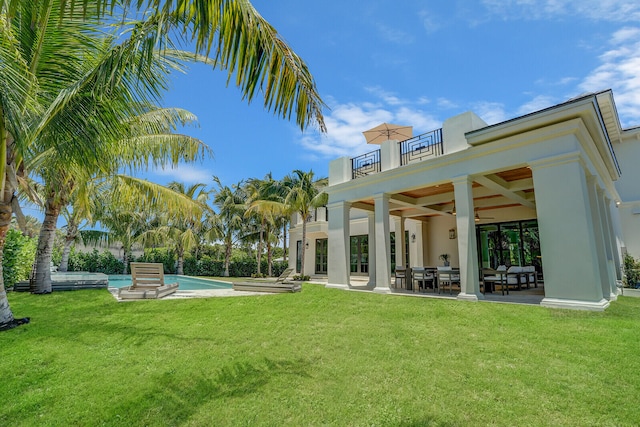 view of swimming pool featuring a patio area and french doors