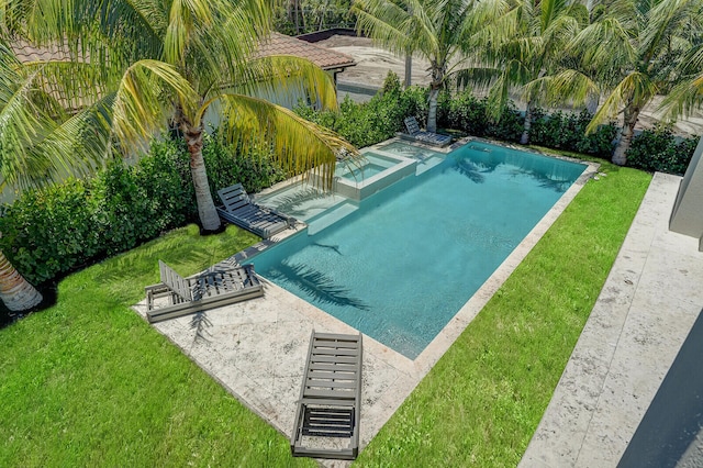 view of swimming pool with a patio and a lawn