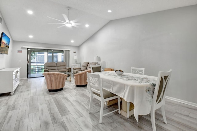 dining area featuring a textured ceiling, ceiling fan, light hardwood / wood-style flooring, and vaulted ceiling