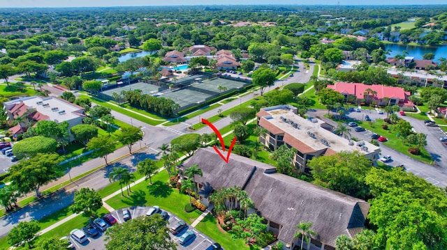 birds eye view of property with a water view